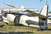 149876 - On the West Side of US-1 about 1 mile south of St.Augustine Airport FL - there is a grassed compound holding 9 x Ex Navy , Grumman Trackers