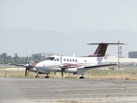N383JP @ ONT - Parked in the grassy area - by Helicopterfriend