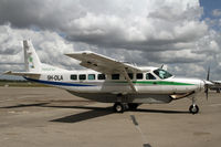 5H-OLA @ HTDA - Tropical Air Caravan taxiing in to the commuter ramp - by Duncan Kirk