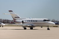 N860QS @ KDPA - Photographed through a chain-link fence. - by Glenn E. Chatfield