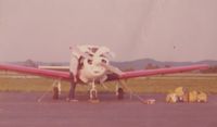 N5310K - Dad, pilot Butch Hawes, under the hood, conducting pre-flight walkaround, prior to take-off from private airport at Show Low, AZ. circa 1975.  Typical luggage load for our family of four passengers, ready for cargo hold. Mom, Maris T. Hawes, co-pilot. - by Chimene Hawes