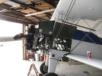 N1702B @ SZP - 1942 Boeing Stearman PT-13D 'Ruthies Doll', Continental W670 220 Hp, maintenance- cowls off - by Doug Robertson