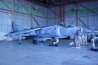 165566 @ NFW - Boeing AV-8B Harrier II+, c/n: 303; Air Expo 2011, In the hangar getting its engine replaced.  It ate the runway. Oops. - by Timothy Aanerud