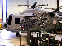 XZ250 @ EGDY - former Royal Navy 'Wildcat' display team Lynx inside Hangar 6. Rumoured to be going to the International Helicopter Museum, Weston-super-Mare - by Chris Hall