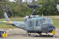 151268 @ NPA - 1964 Bell UH-1E Iroquois, c/n: 6003 in outside storage at Pensacola Naval Museumm - by Terry Fletcher