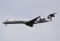 N215AG @ KSEA - First CRJ to appear in the Alaska Airlines colors. CRJ operations are now being operated by Skywest Airlines. - by Joe G. Walker