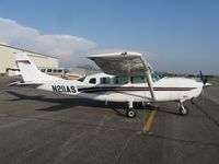 N211AS @ KAXN - Cessna T207 Turbo Skywagon on the line. - by Kreg Anderson