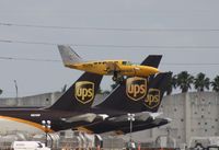 N521FA @ MIA - Cessna 402C - by Florida Metal