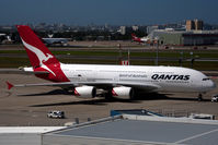 VH-OQB @ YSSY - puching back - by Bill Mallinson