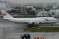 JA8173 @ YSSY - typical Sydney....rain, rain and more rain ! - by Bill Mallinson