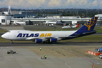 N412MC @ YSSY - taxi to cargo area - by Bill Mallinson