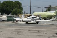 N1085W @ KCNO - Getting some work done. Note: N3996V inside the fence - by Nick Taylor Photography