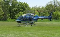 N406LL @ NONE - Bell 407 from LifeLink III doing a presentation of a mock car crash at Jefferson High School, Alexandria, MN.