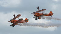 N74189 @ EGSU - N74189 (2) & N707TJ(3) working very hard in extremely blustery conditions at at Duxford's Spring Air Show, May 2011