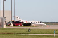 N116SS @ KCID - Photographed from the Rockwell-Collins hangar - by Glenn E. Chatfield