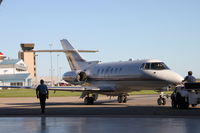 N800RC @ KCID - Pushing out of the Collins hangar - by Glenn E. Chatfield