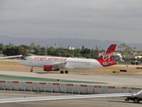 N838VA @ LAX - Starting take off roll on runway 24L - by Helicopterfriend