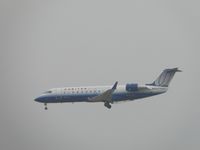 N979SW @ ONT - United Express flown by Sky West on final to runway 26R during a very hazy morning - by Helicopterfriend