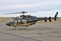 N428TG @ CNY - Bell Helicopter Textron Canada 407, c/n: 53884 refuels at Moab - by Terry Fletcher