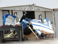 N68BL @ CNO - The Blue Max is in pieces and parked near Century Aircraft Painting - by Helicopterfriend