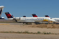 N595SW @ IGM - 1999 Bombardier CL-600-2B19, c/n: 7292 WFU at Kingman - by Terry Fletcher