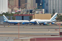 VP-BLK @ LAS - 1979 Boeing 747SP-31, c/n: 21961/415 (right) and sister craft at Las Vegas - by Terry Fletcher