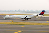 N907XJ @ JFK - 2007 Bombardier CL600-2D24, c/n: 15139 taxying in at New York JFK - by Terry Fletcher