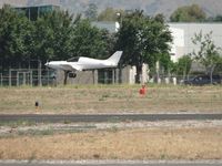 N821EZ @ POC - Making a low pass westbound on runway 26R - by Helicopterfriend