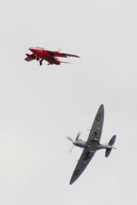 G-RORI @ EGBP - BBMF Spitfire AB910 making a visual inspection of the undercarriage on G-RORI after the cockpit indicators showed it had not locked down, thankfully it was just a faulty indicator. - by Chris Hall