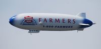 N704LZ @ BEH - The Farmers Insurance Group & Airship Ventures as a partner, the Airship Zeppelin.
Heading towards Chicago, after buzzing over Silver Beach, Saint Joseph, Michigan.  Temp 85F and sunny! - by Mark Parren 269-429-4088