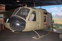 65-9667 - Part of a Vietnam War display.  This aircraft is a Vietnam War combat vet and had small arms fire damage.  Was at the Carolinas Aviation Museum.  Last active with 25th Aviation Battalion - by Glenn E. Chatfield