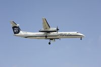 N443QX @ KLAX - Landing at LAX - by Todd Royer
