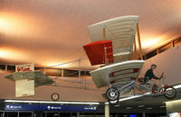 N28CD @ KMSP - This Curtiss replica was a nice surprise upon our arrival at MSP.  Yes, the clock in the background says it's midnight.  Gotta love flight delays! - by Daniel L. Berek
