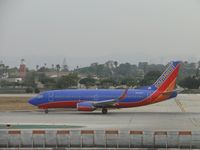 N602SW @ LAX - Waiting to start take off roll on runway 24L - by Helicopterfriend