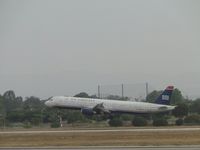 N535UW @ LAX - Flaring out to let the main gear touch down first on runway 24R - by Helicopterfriend