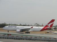 VH-EBH @ LAX - Starting take off roll on runway 24L - by Helicopterfriend