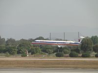 N543EA @ LAX - Landing on runway 24R - by Helicopterfriend