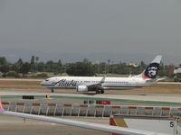 N557AS @ LAX - Dropped off passengers, loaded with more and is now departing westbound on runway 24L - by Helicopterfriend