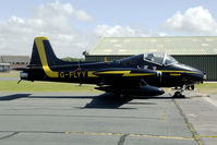 G-FLYY @ EGOW - parked between the hangars at Woodvale - by Joop de Groot