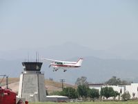 N6796H @ POC - taking off from runway 26L and passing the tower for a straight departure - by Helicopterfriend