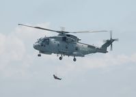 ZH835 - Off airport. Fleet Air Arm Merlin helicopter coded (5)87/CU of 824 NAS displaying on the first day of the Wales National Airshow, Swansea Bay, Wales, UK. - by Roger Winser
