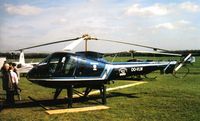 OO-VLW @ EGKR - scanned print taken at Helitech a few years ago - by Andy Parsons