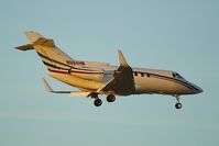 N984HM @ KSAT - Setting sun providing just enough light for a shot - by RWB