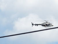 N34FW - Took a picture while it was flying over downtown Birmingham.   It flew several circles over the railroad park area flew off, returned, then flew away. - by J. Aaron Sims