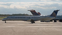 N14916 @ KMKE - Seen taxying past two DC-9s, both of which would eventually wear Delta's new colors. - by Daniel L. Berek