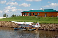 N62744 - 1978 Piper PA18-150 N62744 and a Nice Home on the Chena River - Fairbanks, AK - by scotch-canadian