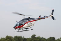 N51AE @ KEOK - Departing southeast - by Glenn E. Chatfield