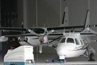 UNKNOWN @ ABQ - Taken at Alburquerque International Sunport Airport, New Mexico in March 2011 whilst on an Aeroprint Aviation tour - unknown Cessna 208 hiding in the hangar - by Steve Staunton