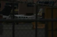 N306PW @ ABQ - Taken at Alburquerque International Sunport Airport, New Mexico in March 2011 whilst on an Aeroprint Aviation tour - hiding behind a chain link fence in the gathering gloom - by Steve Staunton