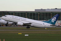 ZK-NGR @ NZCH - away from 02, with the Intl Terminal in background - by Bill Mallinson